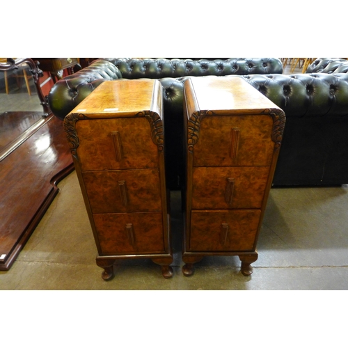 23 - A pair of Art Deco figured walnut pedestal chests