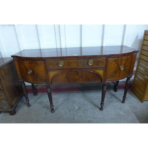 31 - A George IV inlaid mahogany breakfront sideboard