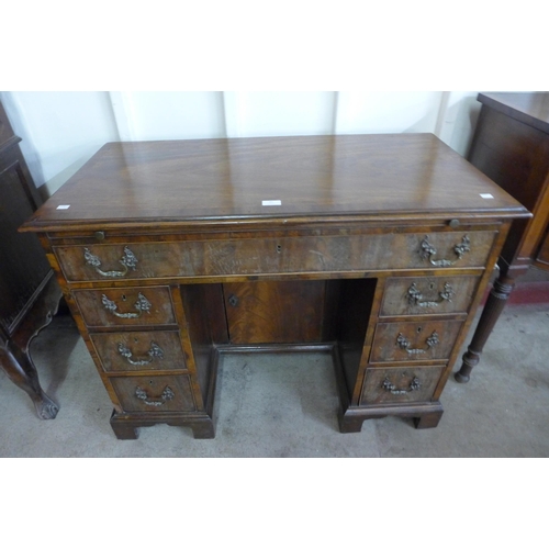 32 - A George III mahogany kneehole desk