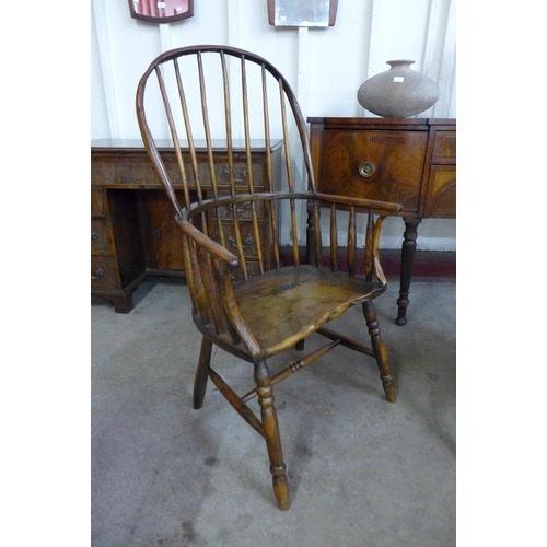 36 - A pair of primitive yew wood Windsor comb back armchairs