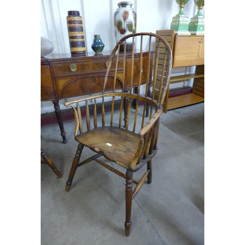 36 - A pair of primitive yew wood Windsor comb back armchairs