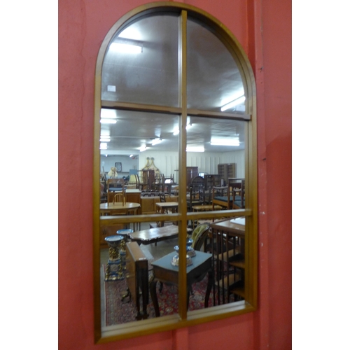 39 - A teak Cathedral style mirror