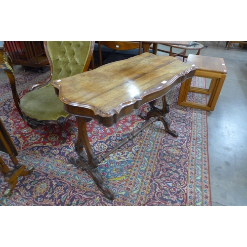 4 - An early Victorian rosewood stretcher table