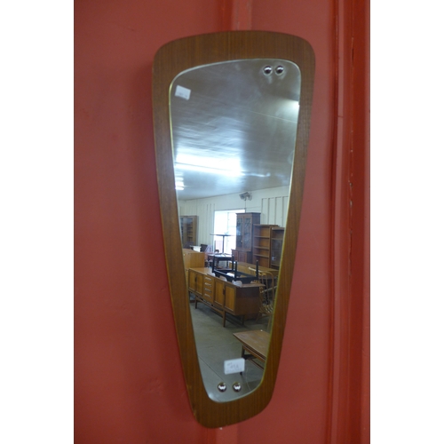 49A - A teak asymmetrical framed mirror