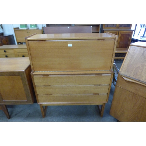 51 - A Turnidge of London teak writing cabinet