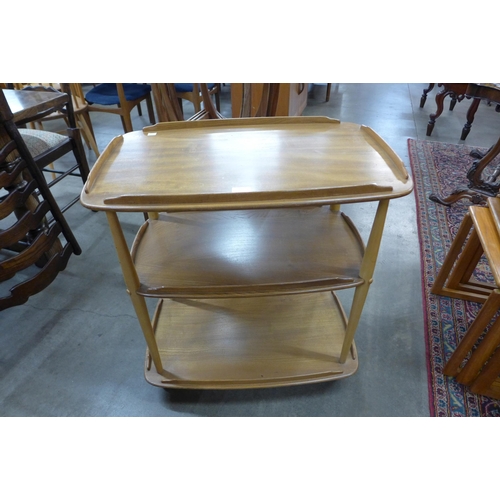 59 - An Ercol Blonde elm and beech Windsor trolley