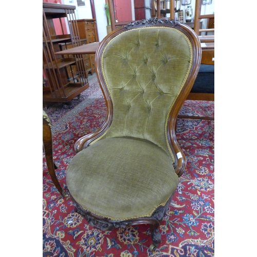 6 - A Victorian carved walnut and green fabric upholstered lady's chair