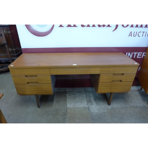 65 - A Uniflex teak desk