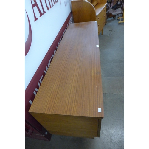 65 - A Uniflex teak desk