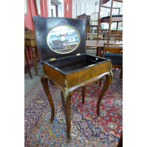 7 - A Victorian inlaid walnut and ormolu mounted lady's dressing table