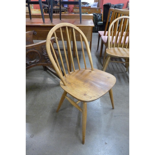 78 - An Ercol Blonde elm and beech drop leaf table and four Windsor chairs