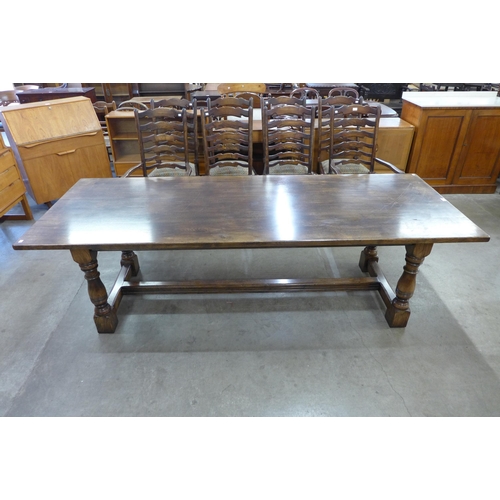 96 - An 18th Century style oak refectory table, 73cms h, 244cms l, 91cms w