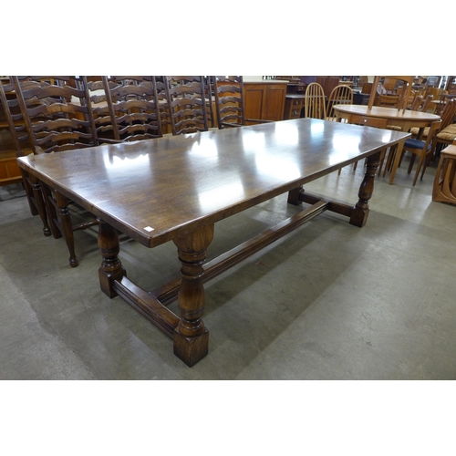 96 - An 18th Century style oak refectory table, 73cms h, 244cms l, 91cms w