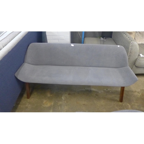 1466 - A grey fabric three seater bench with dark oak legs