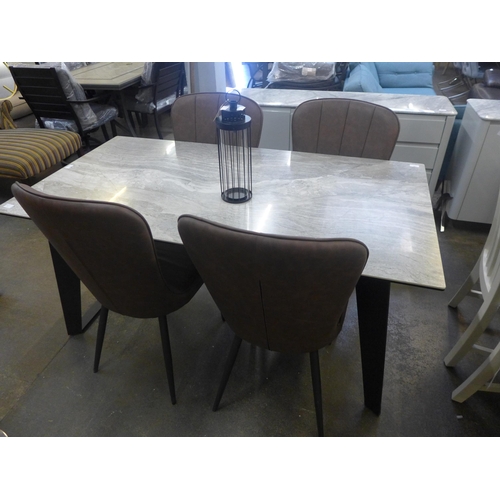 1537 - A ceramic topped dining table and four tan upholstered chairs