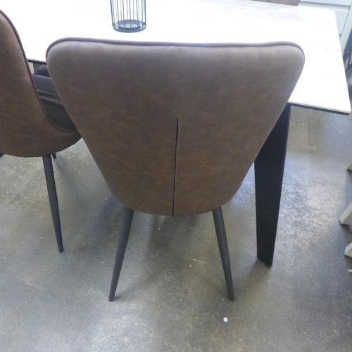 1537 - A ceramic topped dining table and four tan upholstered chairs