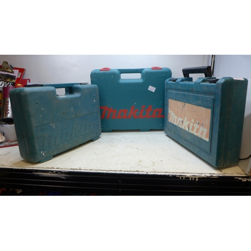 2031 - 3 Makita corded and cordless drills in cases