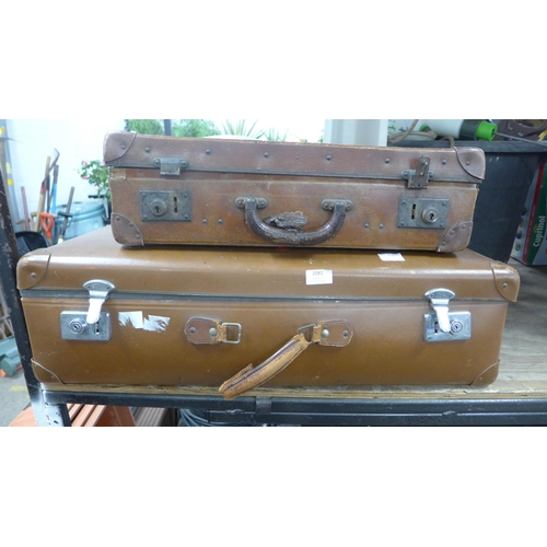 2082 - Two vintage suitcases, quantity of brass items and an Encore left handed acoustic guitar