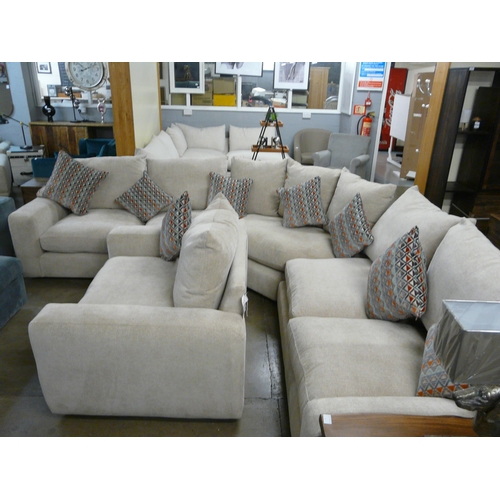 1382 - A Champagne upholstered curved corner sofa and loveseat with a set of scatter cushions