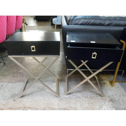 1523 - A pair of black bedside tables with cross legs