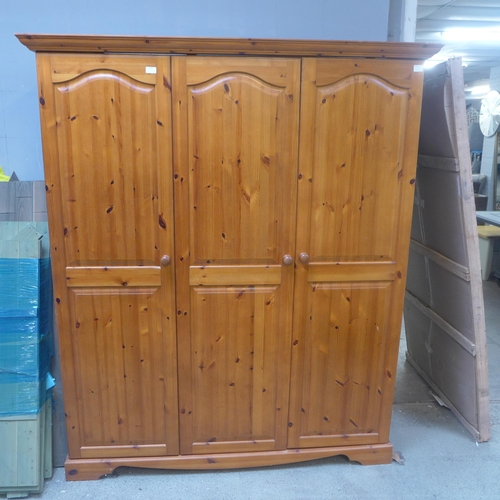 1596 - A pine triple full hanging wardrobe