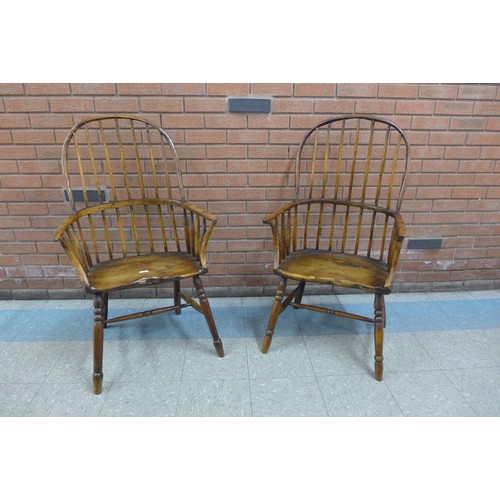 36 - A pair of primitive yew wood Windsor comb back armchairs