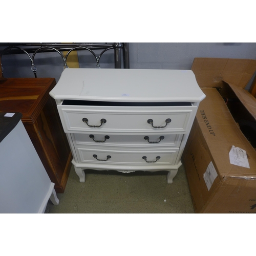 1632 - A three drawer chest with contrast top and a square chrome mirror (damaged)