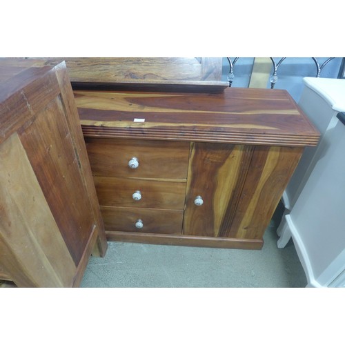 1635 - A hardwood three drawer two door sideboard, wine rack and wall hanging mirror