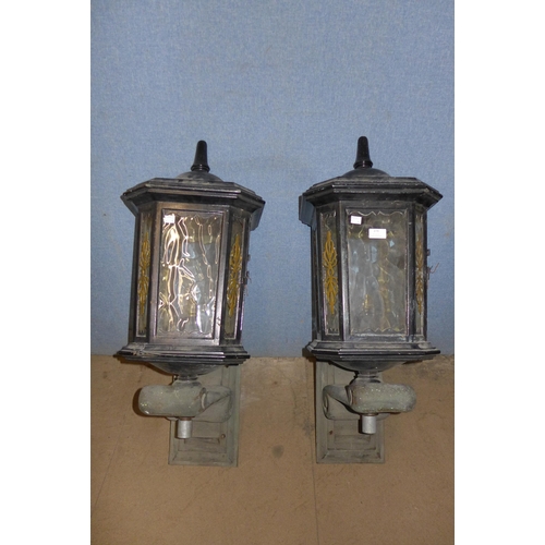 599 - A pair of painted alloy lanterns, on bronze brackets