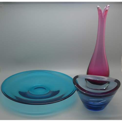 606 - Three items of Swedish glass ; A sea Glasbruk pink cased beak vase, 29.5cm, a Stromberg blue bowl an... 