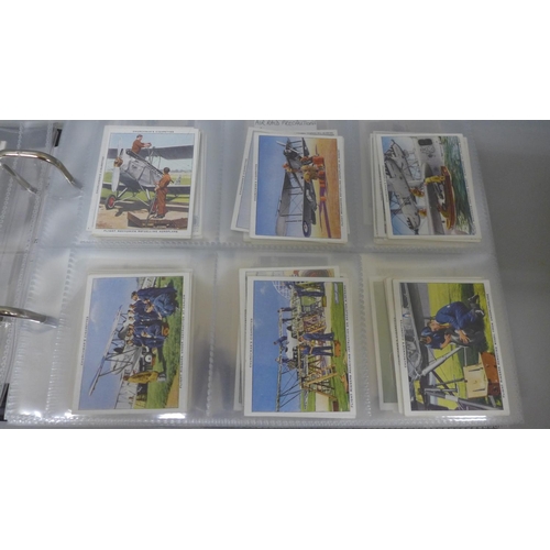 627 - Cigarette cards, album of military related cigarette cards, ten complete sets