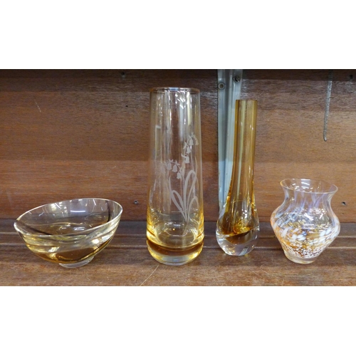 638 - Caithness glass; an amber cased bud vase, a bowl with threads of coloured glass and two other vases