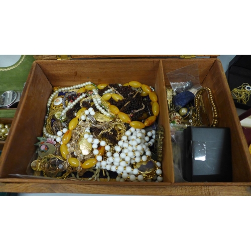 659 - Costume jewellery in a carved wooden box