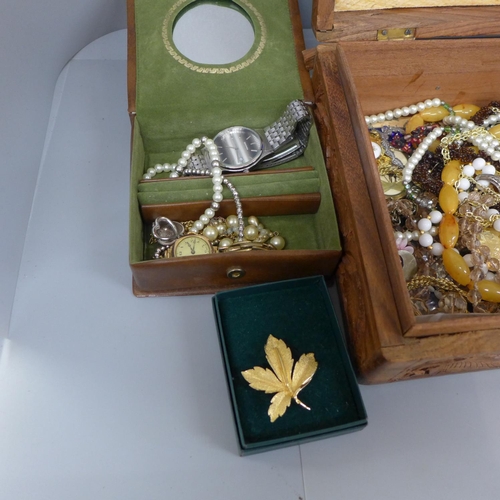 659 - Costume jewellery in a carved wooden box