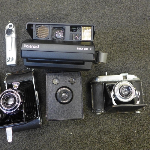 690 - A collection of cameras including Polaroid and folding and spy camera (9)