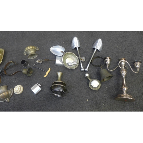 710 - A collection of metal ware including a door bell and chamberstick