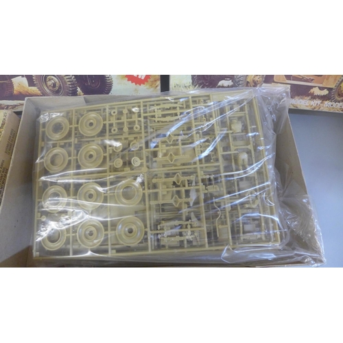 717 - Three Airfix plastic model kits, white M3A1 Scout car, and two Bedford QL Gun Portee