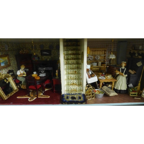 745 - A Georgian style dolls house, with furniture, accessories and dolls, electric set up **PLEASE NOTE T... 