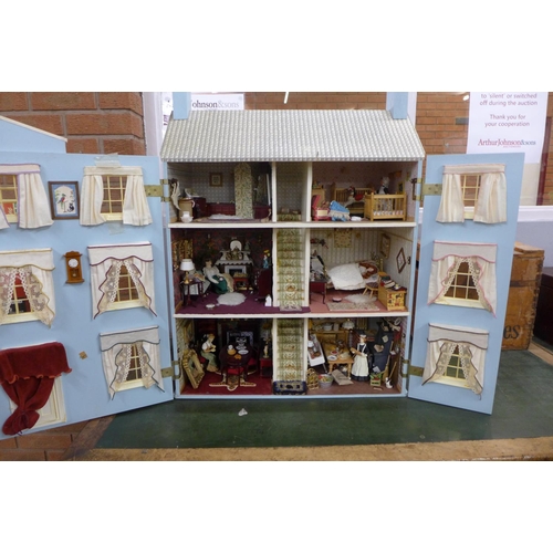 745 - A Georgian style dolls house, with furniture, accessories and dolls, electric set up **PLEASE NOTE T... 