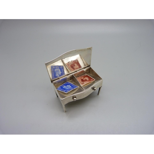 799 - A small silver novelty table stamp box, Birmingham 1910, 51g, 58mm wide