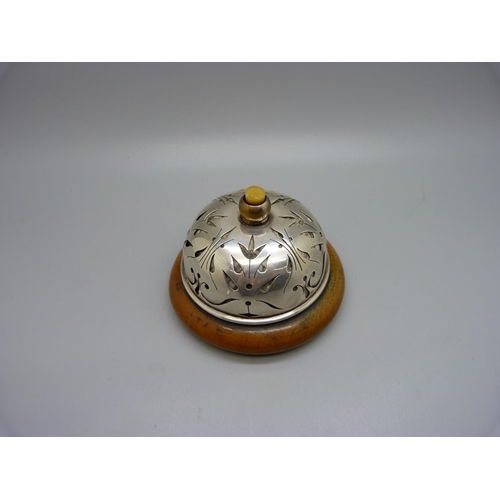 820 - A silver and wooden clockwork/winding 
'buzzing' table bell, Birmingham 1909, Lawrence Emanuel