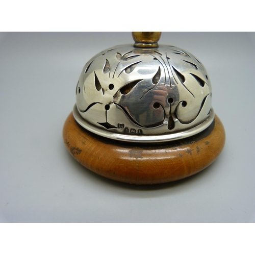 820 - A silver and wooden clockwork/winding 
'buzzing' table bell, Birmingham 1909, Lawrence Emanuel