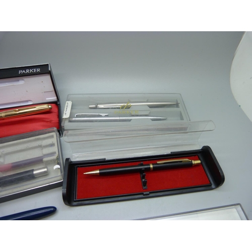 856 - A collection of pens including Parker pen and pencil set, Parker with 14ct gold nib, a 12ct rolled g... 