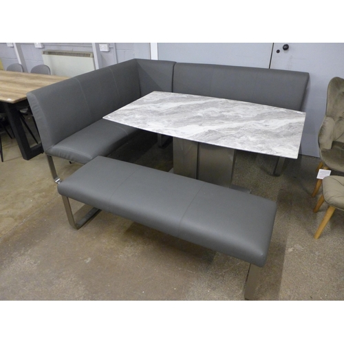 1451 - A Saturn fixed top marble effect and chrome dining table with a grey leather effect bench set