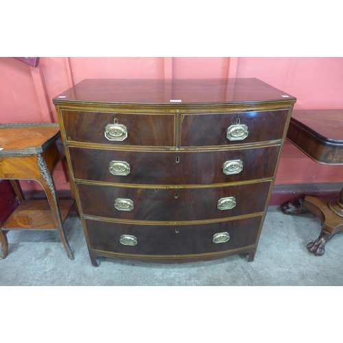 10 - A Regency mahogany and brass inlaid bow front chest of drawers