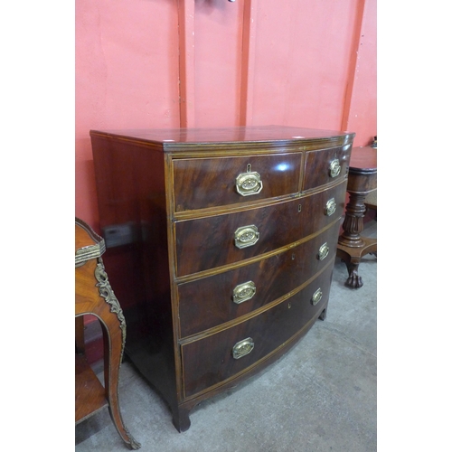 10 - A Regency mahogany and brass inlaid bow front chest of drawers