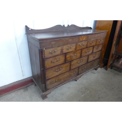 132 - A George II inlaid mahogany fourteen drawer Lancashire chest