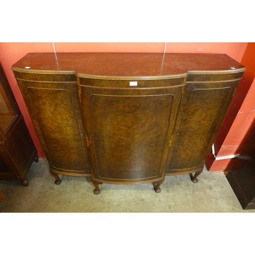 21 - An early 20th Century burr walnut three door enclosed bookcase