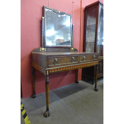 23 - An Art Deco Egyptian Revival walnut and painted leather dressing table, manner of Carlo Bugatti