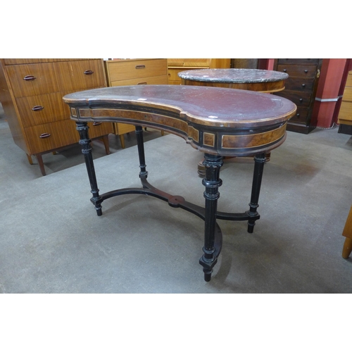 25 - A Victorian Gillows ambonya, ebonised and leather topped kidney shaped writing table